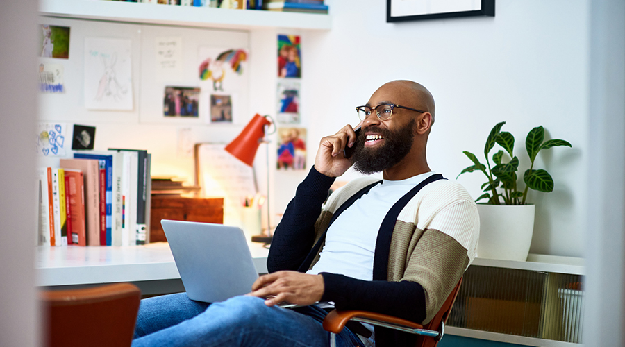 Man sitting on the chair and talking on the phone